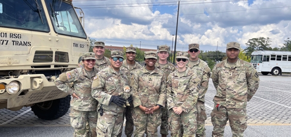 MGA welcomed to the Macon Campus members of the Georgia National Guard, 1177th Transportation Company and 265th Chemical Battalion, as they set up a staging area in one of the campus's west parking lots as part of the state's Hurricane Helene relief efforts. Sgt. 1st Class Mary Howell said their role involved transporting FEMA and GEMA supply trailers to various locations with water, ready-to-eat meals, and other supplies to hard-hit locations in Georgia. Image: Sheron Smith